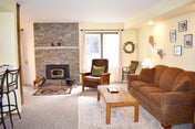 #127 Warm and inviting corner unit across from the shuttle stop and close to the Village