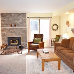 #127 Warm and inviting corner unit across from the shuttle stop and close to the Village