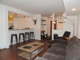 Modern corner condo #185, backs up to a treed lot - Image 2