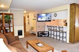 #127 Warm and inviting corner unit across from the shuttle stop and close to the Village - Image 2