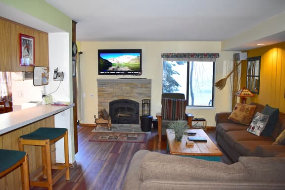 Feel at home with inviting corner condo, close to shuttle stops and The Village - Image 1